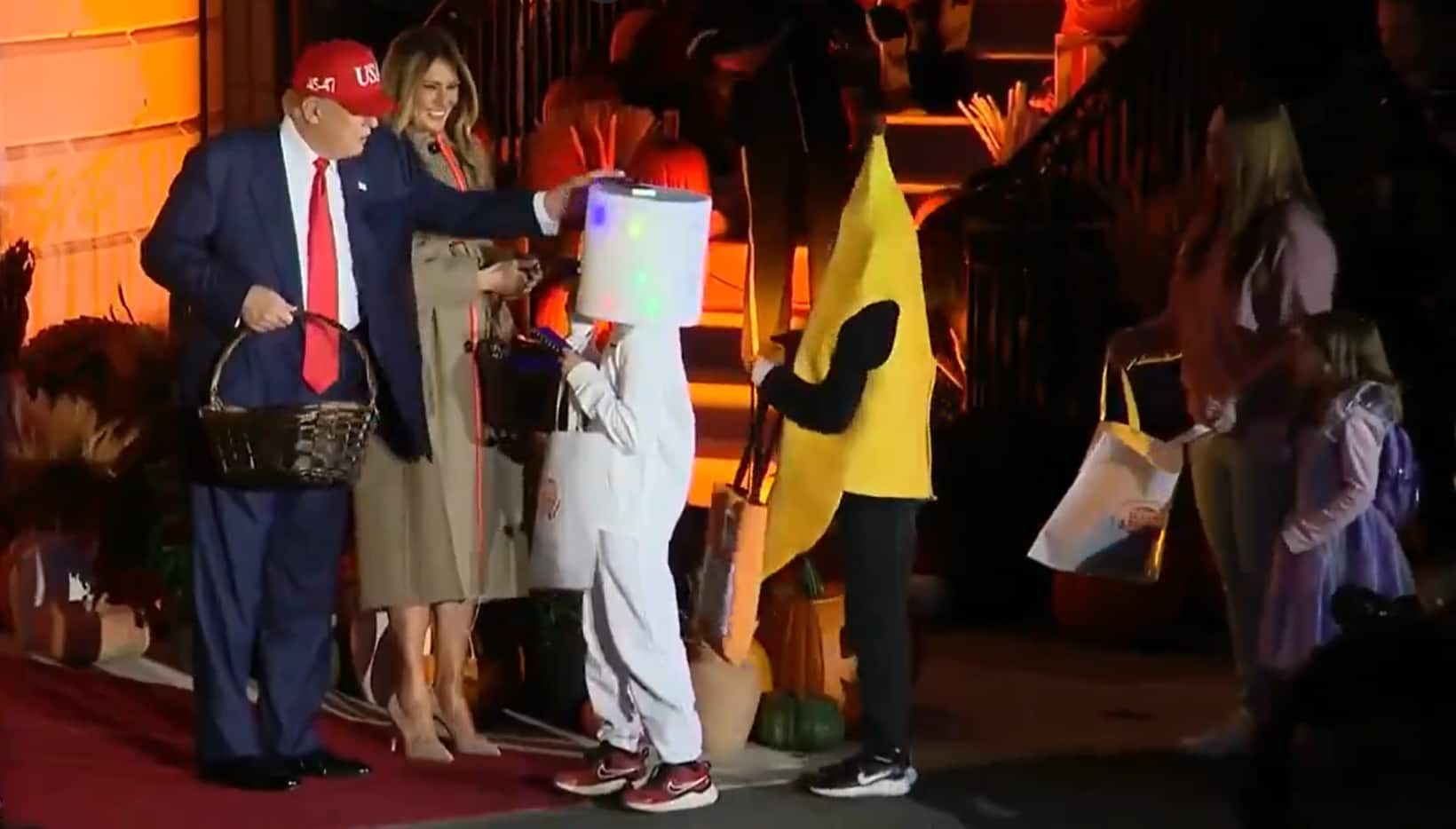 Trump balances candy on a kid’s head, again