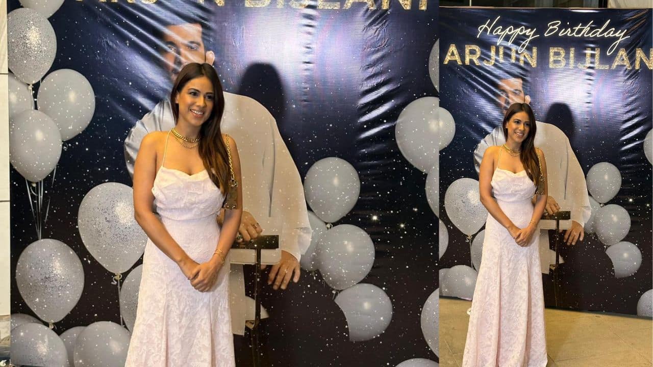 Nia Sharma  She is known for giving fashion inspiration and graced the occasion in a halter self printed gown. With minimal accessories, she looked pretty as a picture. She wore a simple neckpiece to go with the outfit. 