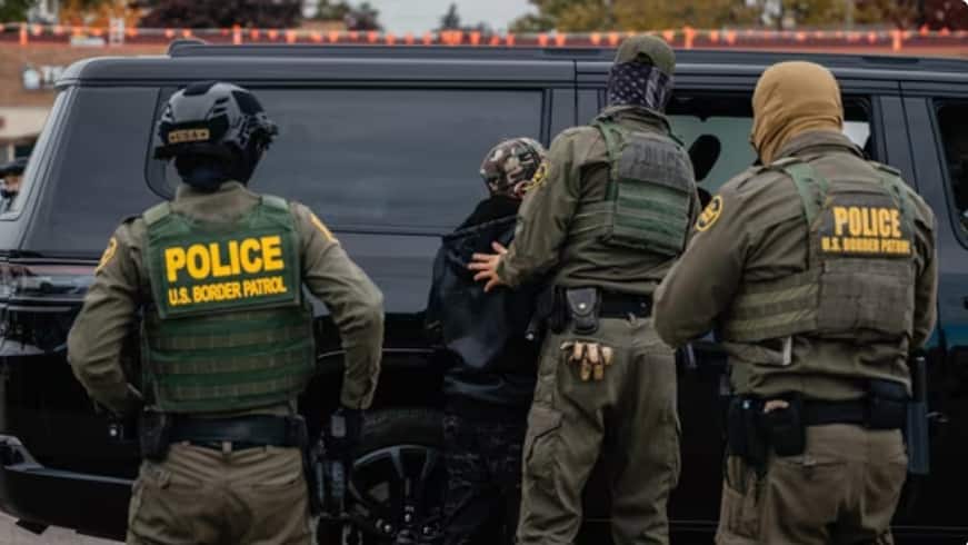 Video shows immigration agent punching restrained man after car crash in Chicago suburb