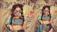 <strong>Boho chic</strong><br />As much as she looks good in traditional wear, she can carry boho chic looks with a tang of oomph. With braids, sunglasses, a high waisted printed bikini and a colourful cape, she looks all things fashionable.
