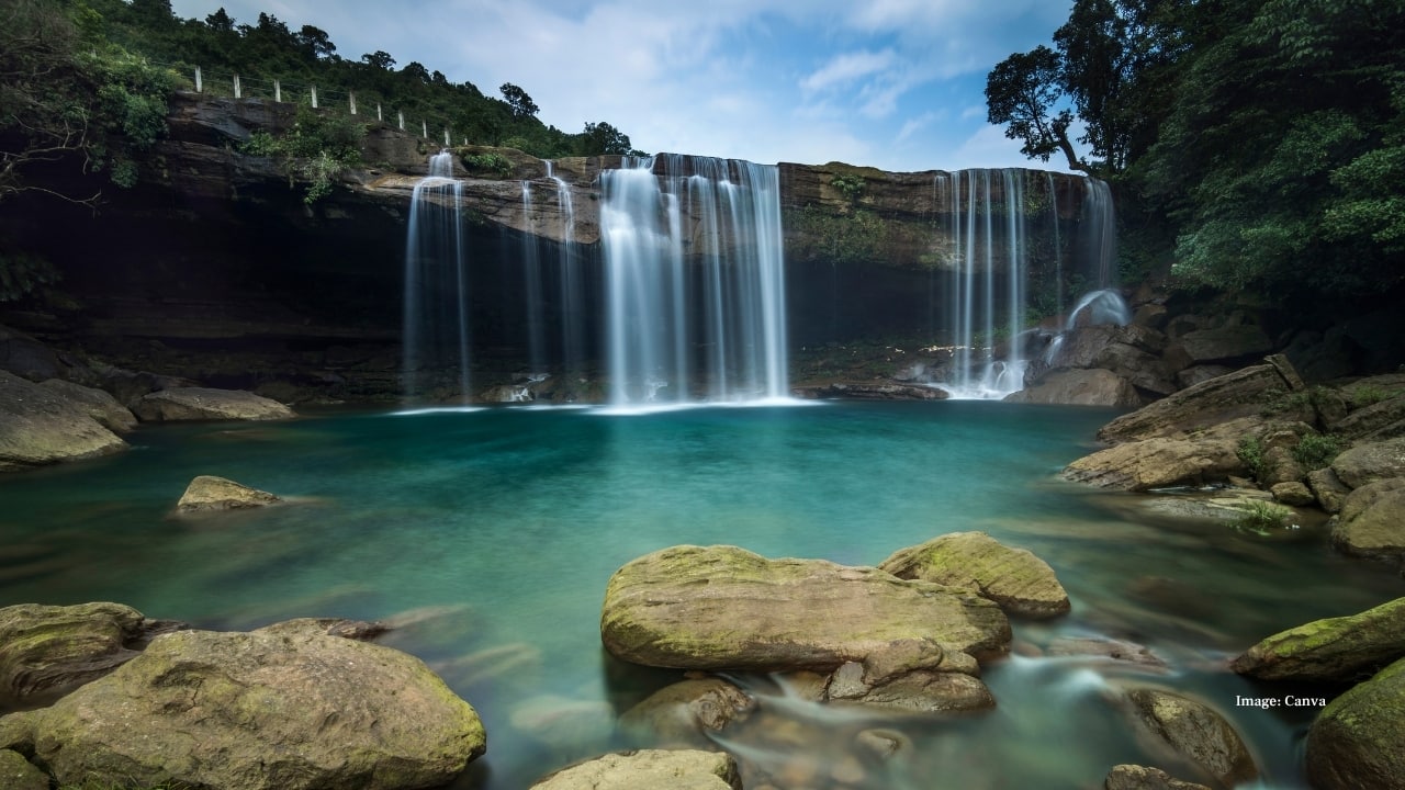 Tucked away in India’s Northeast, Meghalaya — the “Abode of Clouds” — is where nature plays its finest symphony. From mist-draped hills and whispering waterfalls to living root bridges and glowing caves, every corner feels like a secret waiting to be told. It’s a land where the air smells of rain, the skies brush against emerald valleys, and time slows to match the rhythm of rustling leaves.