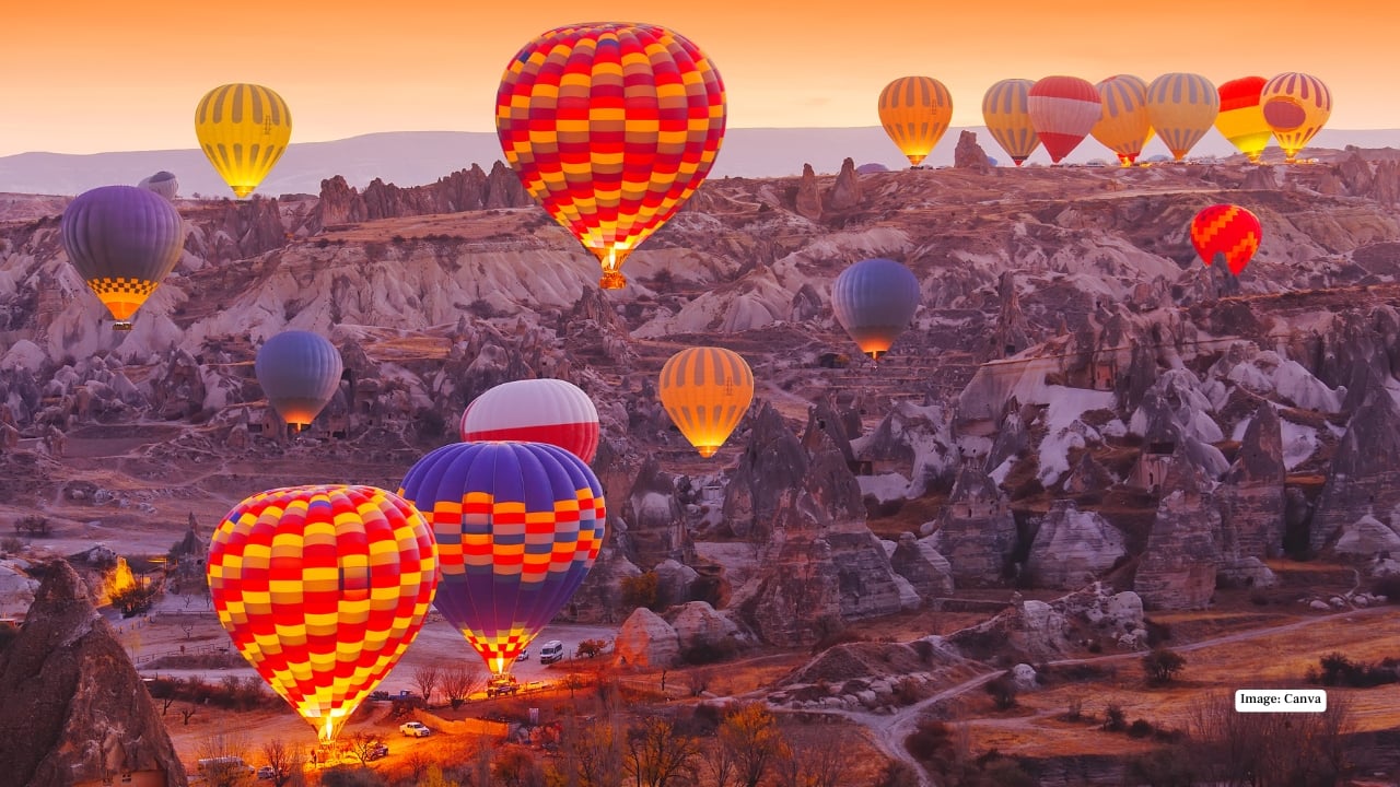 5. Float Above Turkey’s Surreal Landscapes In Cappadocia, dawn paints the sky in shades of apricot and rose as hundreds of hot-air balloons rise silently over honey-colored canyons. Below, fairy chimneys and cave dwellings whisper stories of ancient civilizations. Few moments rival this — serenity suspended in air.