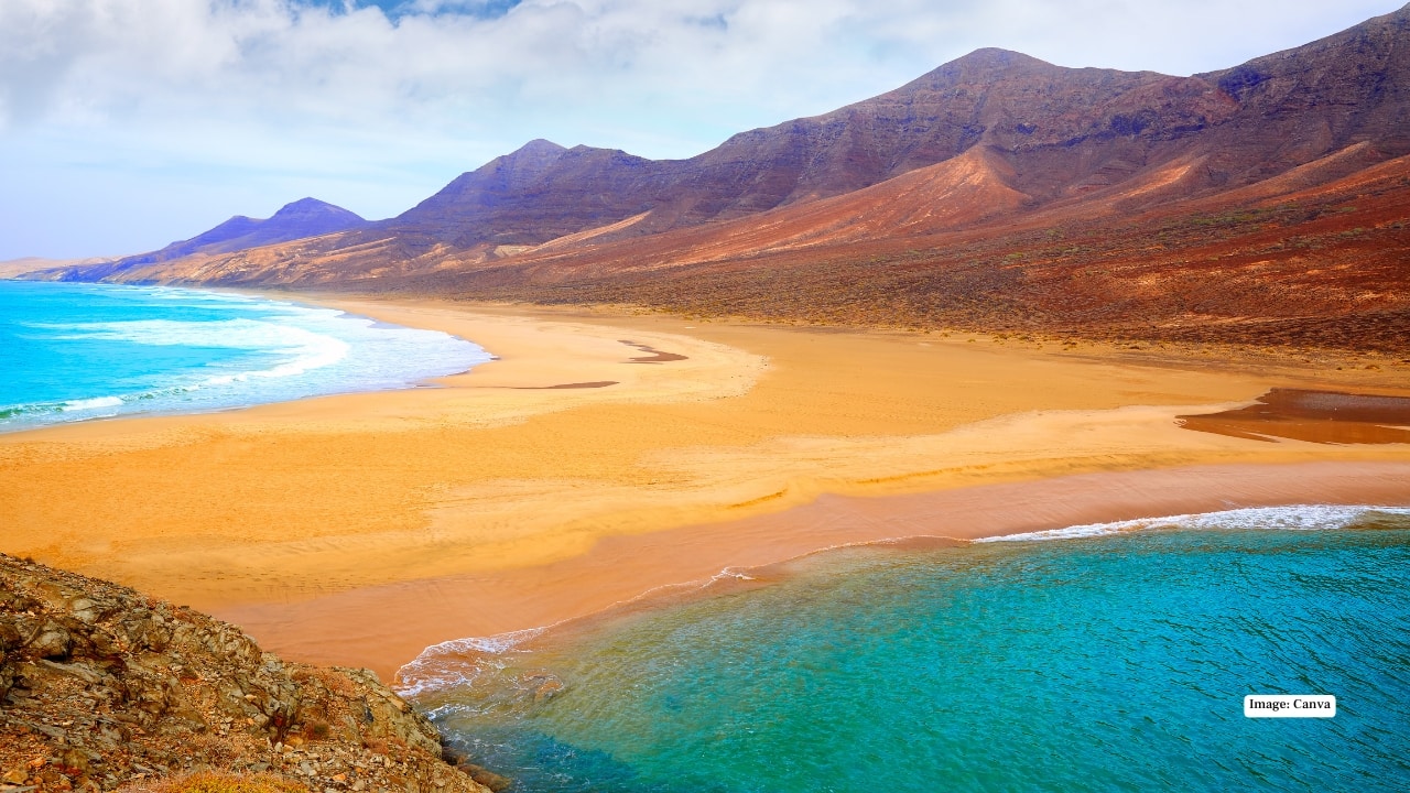 2. Fuerteventura, Canary Islands What if you could have summer in January? Fuerteventura’s volcanic landscapes and endless beaches offer the ultimate winter escape. With 21°C days and clear Atlantic skies, you can hike dunes, surf turquoise waves, or simply bask barefoot at Playa del Matorral. When the rest of Europe packs scarves, you’ll be packing sunscreen.