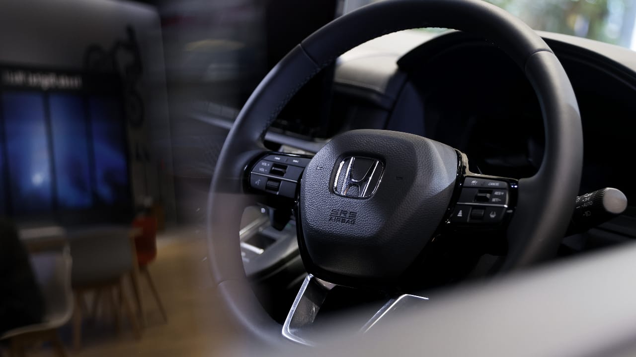 Honda cuts outlook on global chip shortage, gloomy EV demand