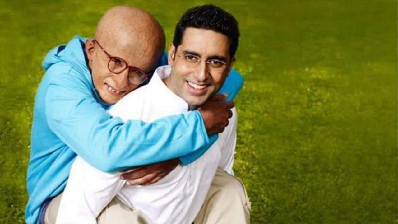 Amitabh Bachchan and Abhishek Bachchan – Paa (2009) The typical father-son narrative was reversed in R. Balki's Paa. Abhishek portrayed his father, Amol Arte, while Amitabh Bachchan portrayed Auro, a 12-year-old boy with a genetic disorder known as "Progeria." The film masterfully examined a father and son's love, acceptance, and understanding while demonstrating how both actors are able to convey intense emotional truth in their roles. Amitabh Bachchan and Abhishek Bachchan – Paa (2009) The typical father-son narrative was reversed in R. Balki's Paa. Abhishek portrayed his father, Amol Arte, while Amitabh Bachchan portrayed Auro, a 12-year-old boy with a genetic disorder known as "Progeria." The film masterfully examined a father and son's love, acceptance, and understanding while demonstrating how both actors are able to convey intense emotional truth in their roles.