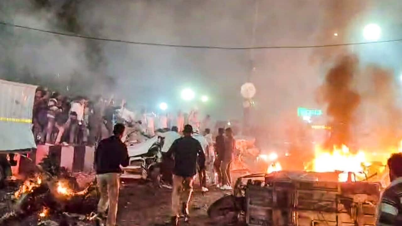 Rescue work underway after a blast occurred in a parked car near Red Fort, in New Delhi, Monday. PTI