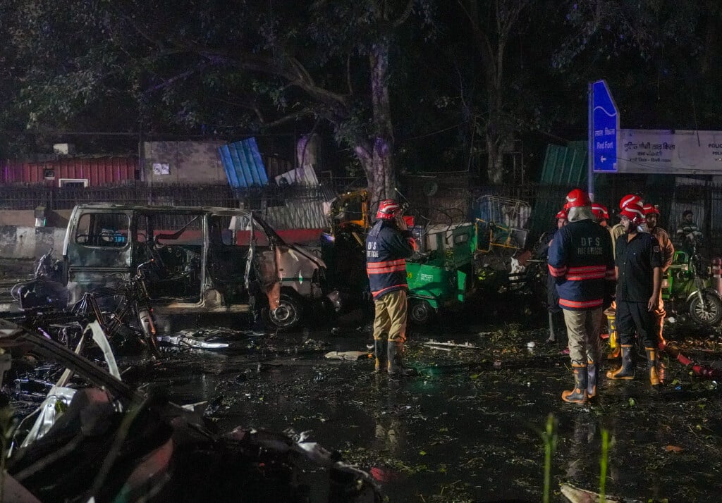 Firefighters at the spot after a blast occurred in a parked car near Red Fort, leaving multiple vehicles in flames, in New Delhi, Monday. PTI