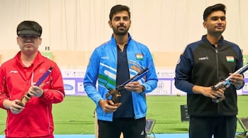 Samrat Rana (centre) poses with compatriot Varun Timar (right) and China's Kai Hu after winning the men's 10m air pistol final at ISSF World Championships in Cairo. (ISSF Photo)