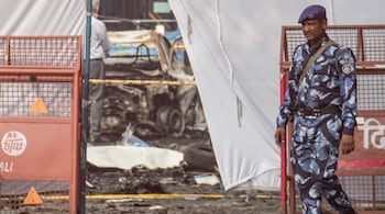 New Delhi: Security personnel at the cordoned off area in view of the blast that occurred near Red Fort Metro Station on Monday, killing 12 people and gutting several vehicles, in New Delhi, Tuesday, Nov. 11, 2025. (PTI Photo/Kamal Kishore)