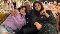 In this adorable photo, Boney Kapoor is surrounded by warmth and love as he celebrates his 70th birthday. As they spend a tender moment together, his daughters Janhvi Kapoor and Anshula Kapoor give their father a tender embrace. Anshula, wearing a black polka-dot dress, holds Boney's hand with a broad smile, while Janhvi, wearing a cosy lavender jumper, leans on his shoulder. This image perfectly captures the family's love and unity on this special day.