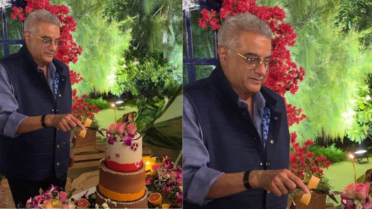 A gorgeously tiered cake and colourful décor surround Boney Kapoor as he celebrates his 70th birthday in style in these photos. The producer appears happy as he carefully cuts the exquisite cake decorated with orchids and roses while wearing a smart navy blue jacket and shirt. The evening's cosy, celebratory atmosphere is enhanced by the warm lights and verdant surroundings, providing the filmmaker with the ideal opportunity to reflect and celebrate this momentous occasion.