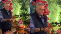 A gorgeously tiered cake and colourful décor surround Boney Kapoor as he celebrates his 70th birthday in style in these photos. The producer appears happy as he carefully cuts the exquisite cake decorated with orchids and roses while wearing a smart navy blue jacket and shirt. The evening's cosy, celebratory atmosphere is enhanced by the warm lights and verdant surroundings, providing the filmmaker with the ideal opportunity to reflect and celebrate this momentous occasion.