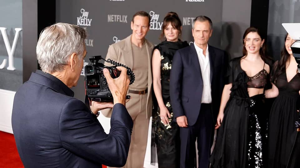 George Clooney turns photographer at Jay Kelly premiere as he snaps Eve Hewson on the red carpet
