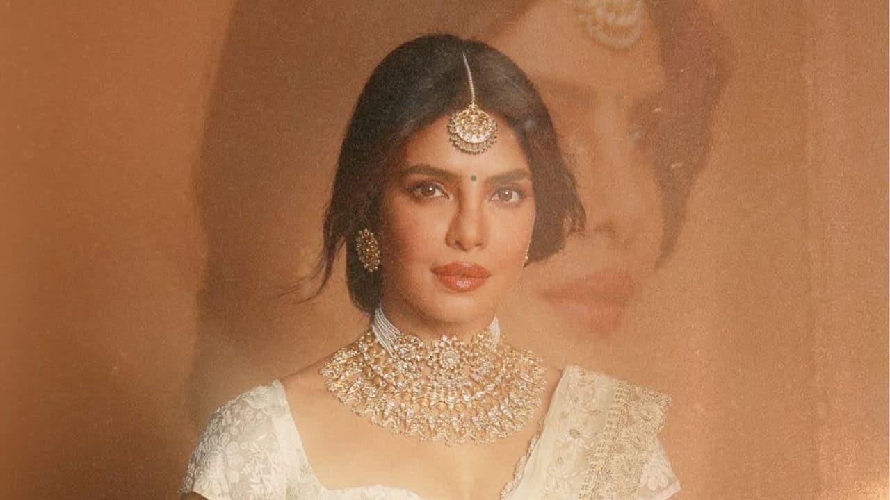 As she channels her character Mandakini from her upcoming movie, Varanasi, Priyanka Chopra radiates divine grace. She appears to be the epitome of elegance and strength while wearing a maang tikka, an elaborately embroidered ivory saree, and an elaborate gold choker. Priyanka shared the photos with the caption, &quot;Channelling my inner Devi. #Mandakini #Varanasi,&quot; which aptly captures the ethereal and spiritual vibe of her appearance.