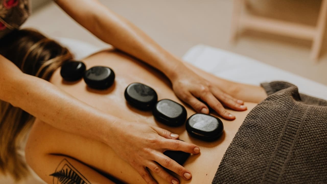 Benefits of hot stone massage: It reduces chronic tension, improves blood flow, and soothes the mind into a meditative state (Image: Pexels)