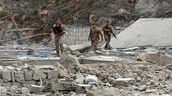 Lebanese army soldiers inspect the site of an Israeli airstrike