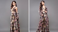 <strong>Floral fantasy</strong><br />She looks quite the floral fantasy in this modern Indian ensemble. The bold print has been used effectively in the crop top, flared pants, and jacket, making her look striking and bold. Her outfit has been styled with a choker and earrings, both complementing the fit beautifully.