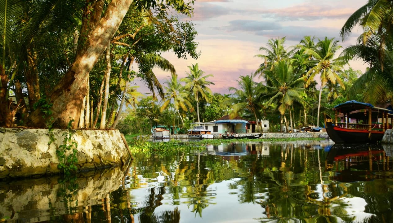 <strong>3. Alleppey Backwaters</strong><br />If Kerala had a postcard, it would be Alleppey. Coconut trees, mirror-like waters and slow-moving houseboats define this dreamy backwater district. Whether you're drifting on a traditional kettuvallam or watching village life unfold on the banks, Alleppey is the essence of Kerala’s calm. (Image: Unsplash)