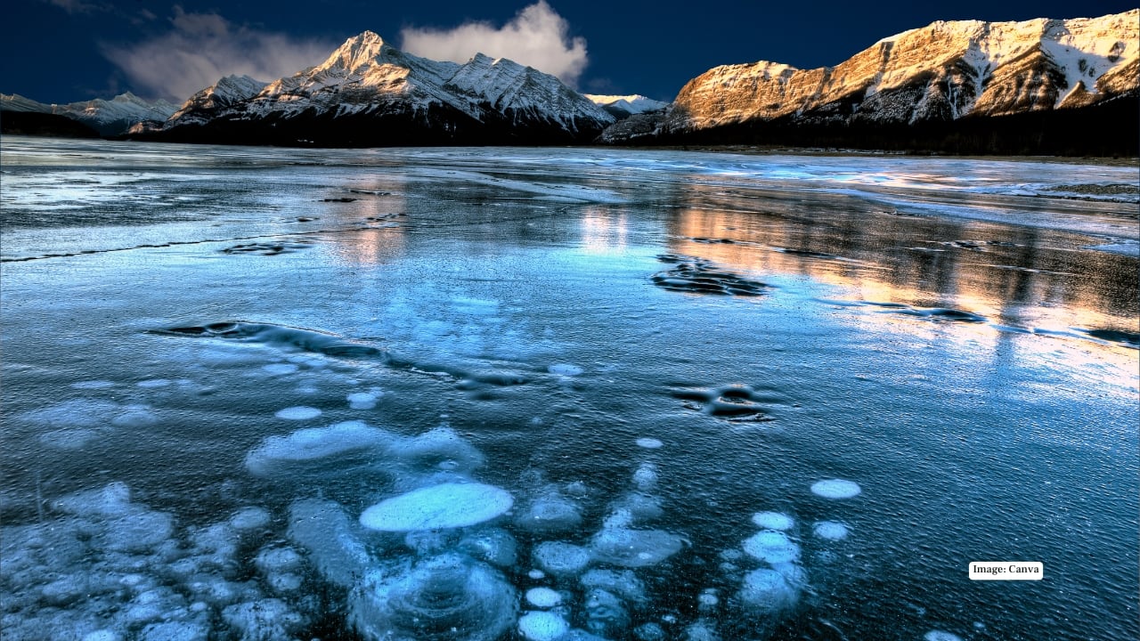 3. Abraham Lake, Canada – A Photographer’s Ice-Dot Dream Ever seen frozen bubbles trapped in time? Abraham Lake is a natural phenomenon, where methane bubbles rise from below and get locked in crystal-clear ice, creating surreal polka-dot patterns. Photographers and nature lovers flock here for this otherworldly spectacle every winter. 3. Abraham Lake, Canada – A Photographer’s Ice-Dot Dream Ever seen frozen bubbles trapped in time? Abraham Lake is a natural phenomenon, where methane bubbles rise from below and get locked in crystal-clear ice, creating surreal polka-dot patterns. Photographers and nature lovers flock here for this otherworldly spectacle every winter.