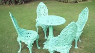 <strong>Vintage garden table setting:</strong> The house has a sprawling garden that’s well maintained and features a vintage table and chair setting in mint green. Raghav credited his father for the furniture he has collected over the years. (YouTube/@curlytalesdigital)