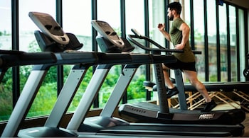What is the viral 12-3-30 routine: Just set your treadmill to a 12 percent incline, walk at 3 mph, and hang in there for 30 minutes (Image: Pexels)