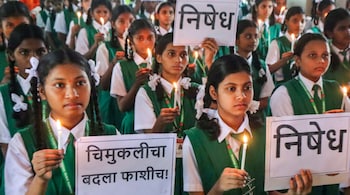 Female students hold a candle march to protest against the alleged rape and murder of a three-year-old girl in Nashik's Malegaon, in Mumbai (PTI Photo)