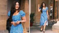 <strong>Playful dress with a slit</strong><br />The actress shines in a playful printed blue dress with a short side slit. Styled with black ballerinas and a beige bucket bag, she looks well put-together for an outing. Her open tresses add to her charm.