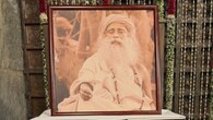 Portrait of Sadhguru placed for blessings - A framed image of Sadhguru was placed at the mandap as part of the rituals. The wedding maintained the spiritual customs central to the Isha Foundation.