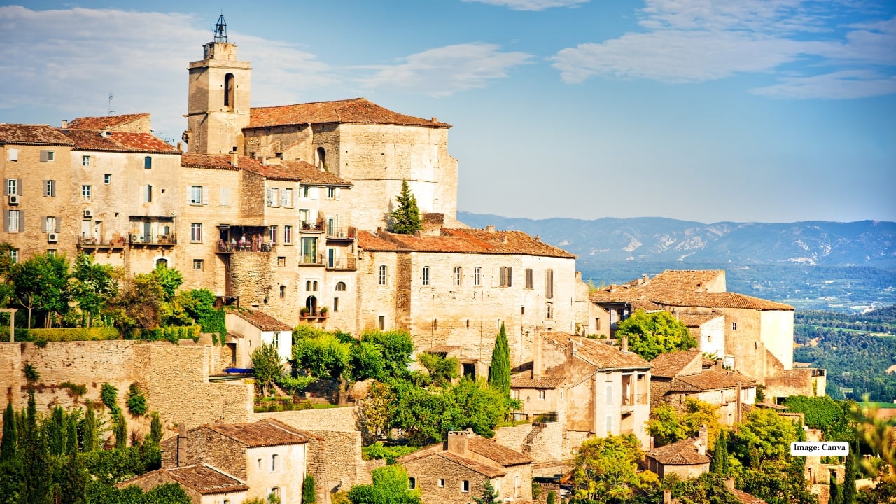 5. Gordes – Lavender-Scented Hilltop Village In the heart of Provence, Gordes perches atop the Luberon hills, offering sweeping views of sun-drenched valleys and lavender fields. Stone streets wind past historic buildings, boutique shops, and sunlit cafés. Visit during late spring or early summer when lavender blooms, and the village becomes a fragrant, colorful paradise. Gordes feels untouched by mass tourism, making it ideal for travelers seeking serenity and postcard-perfect views.
