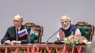 Prime Minister Narendra Modi and Russian President Vladimir Putin during the India-Russia Business Forum, in New Delhi.
