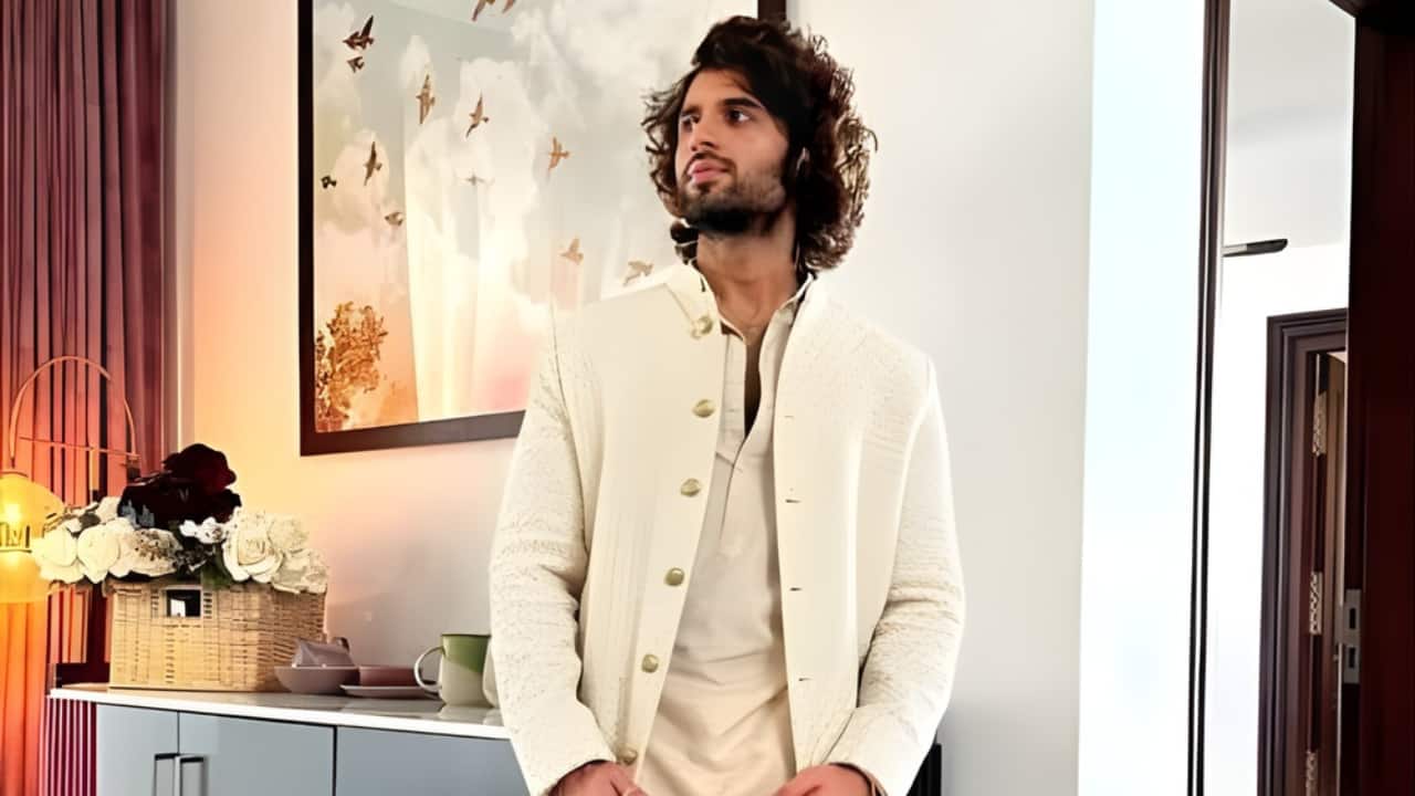 The Bandi and Draped Dhoti Vijay’s style promotes carefree sophistication. The modern, draped dhoti pants are the focal point of the subtle-toned kurta worn over the textured, off-white *Bandi (Nehru jacket). A modern twist on the traditional dhoti, the long, voluminous drape combines comfort and outstanding style. It's the ideal illustration of how to dress traditionally yet feel carefree and prepared for a trip.
