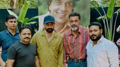 Sunny Deol and Bobby Deol pose with fans of Dharmendra