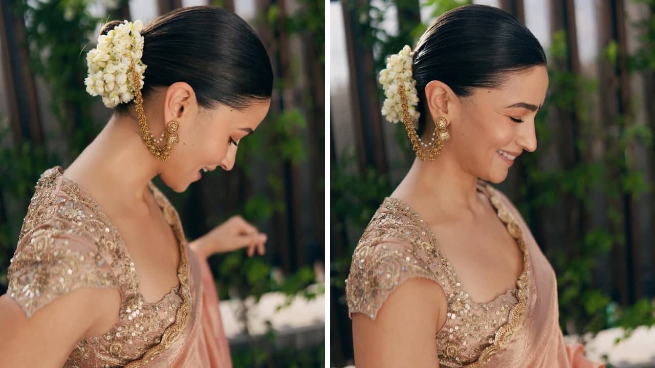 Alia Bhatt: Alia is every bit radiant in the coral and gold tissue saree with a scalloped border and floral embroidery. But what makes it even better is the striking design of the gold ear chain that’s tied to her bun adorned with white gajra. It’s a truly delightful desi look. Alia Bhatt: Alia is every bit radiant in the coral and gold tissue saree with a scalloped border and floral embroidery. But what makes it even better is the striking design of the gold ear chain that’s tied to her bun adorned with white gajra. It’s a truly delightful desi look.