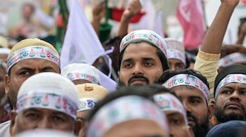 Jamaat-e-Islami party supporters rally in Dhaka on November 11, 2025, demanding the provision of legal status to the 'July Charter' and its ratification by a referendum ahead of Bangladesh's national elections. (Photo by MUNIR UZ ZAMAN / AFP)