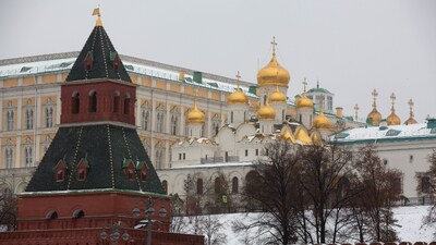 Golden church domes beyond fortified walls in the Kremlin palace complex in Moscow. (Bloomberg)