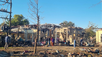 People check damaged buildings at the hospital that was allegedly hit by a military air strike in Mrauk-U township in Rakhine state, Myanmar. (AP image)
