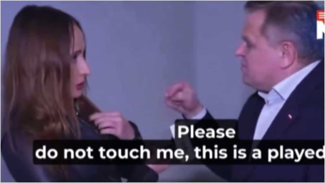 Polish senator appears to yank off journalist's microphone pinned to her jacket: 'Please do not touch me'