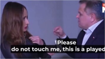 Polish senator appears to yank off journalist's microphone pinned to her jacket: 'Please do not touch me'