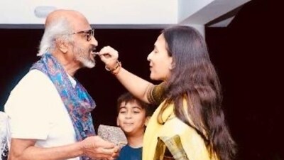 Taking to Instagram, Aishwarya posted a photo of the father-daughter duo, where she is seen feeding him a piece of cake from what appears to be a private birthday celebration.