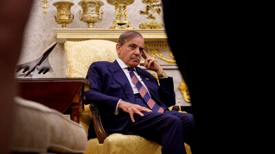 Pakistan Prime Minister Shehbaz Sharif looks on as U.S. President Donald Trump speaks to reporters in the Oval Office of the White House on September 25, 2025 in Washington, DC. 