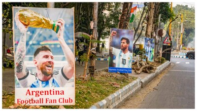 Posters of Lionel Messi along a roadside ahead of his 'GOAT Tour India 2025' at the Vivekananda Yuba Bharati Krirangan stadium, in Kolkata. (Courtesy: PTI photo)