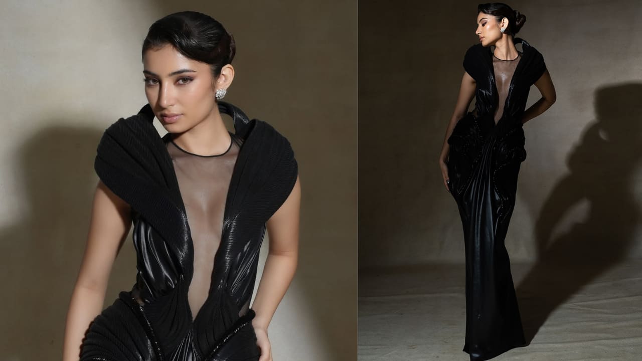 Dramatic black Sara recently shared a series of pictures in this dramatic and high-fashion black gown. It features an architectural, structured collar or shoulder detail, giving it a powerful silhouette. The dress has a deeply plunging neckline with a sheer mesh panel for modesty.