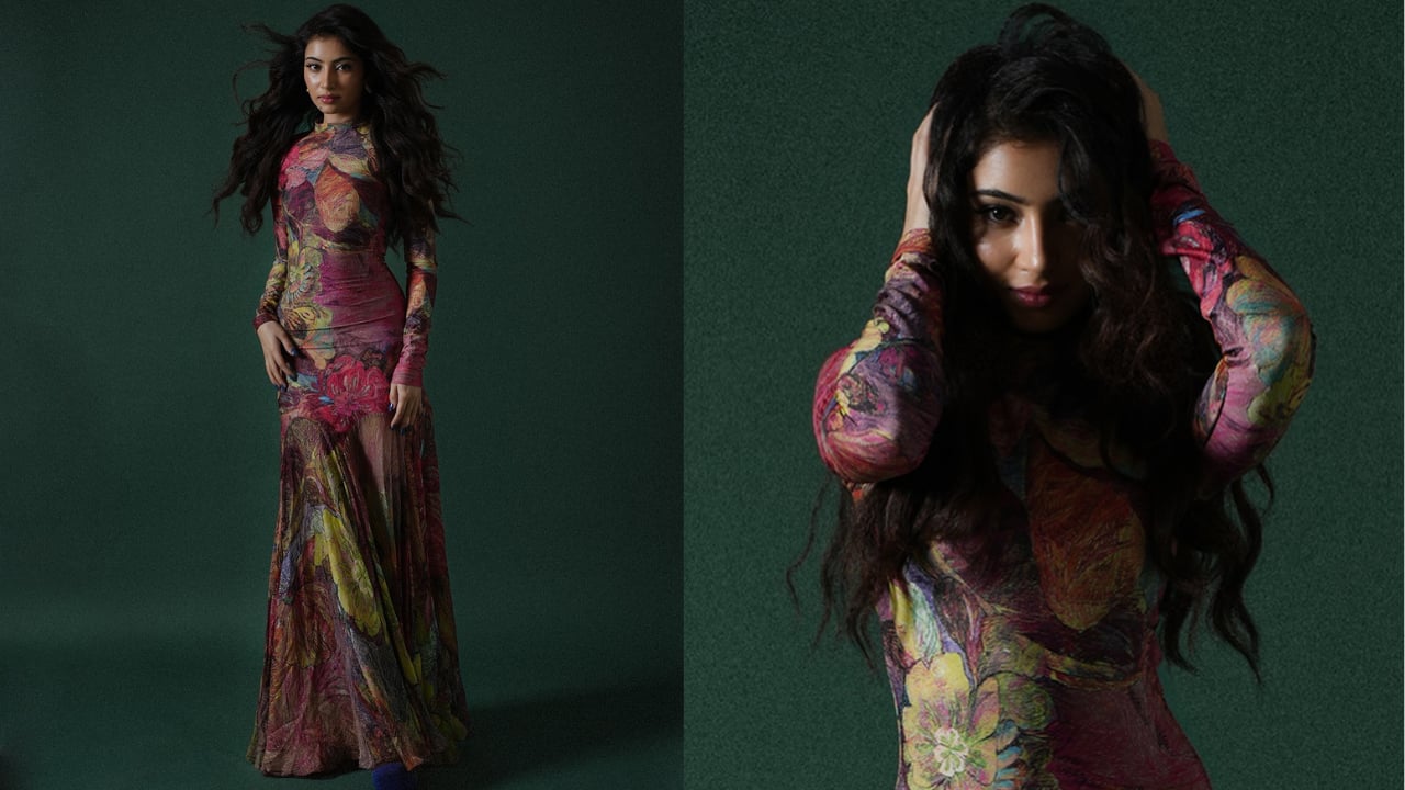 Floral gown Sara sported a vibrant, floor-length, long-sleeved floral gown. The fabric is sheer or mesh, covered in a kaleidoscopic print of brightly colored flowers, predominantly in shades of pink, yellow, red, and green. She kept her hair styled in voluminous, long, dark waves, complementing the dramatic, colourful print of the dress.