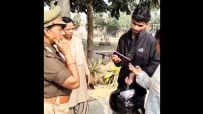 During an inspection as part of women's safety awareness drive, the police officer, Manju Singh, posted as SHO of the 'mahila thana', is seen questioning a youth and two girls who had come to visit the Sheetla temple park from the neighbouring Ghazipur district.
