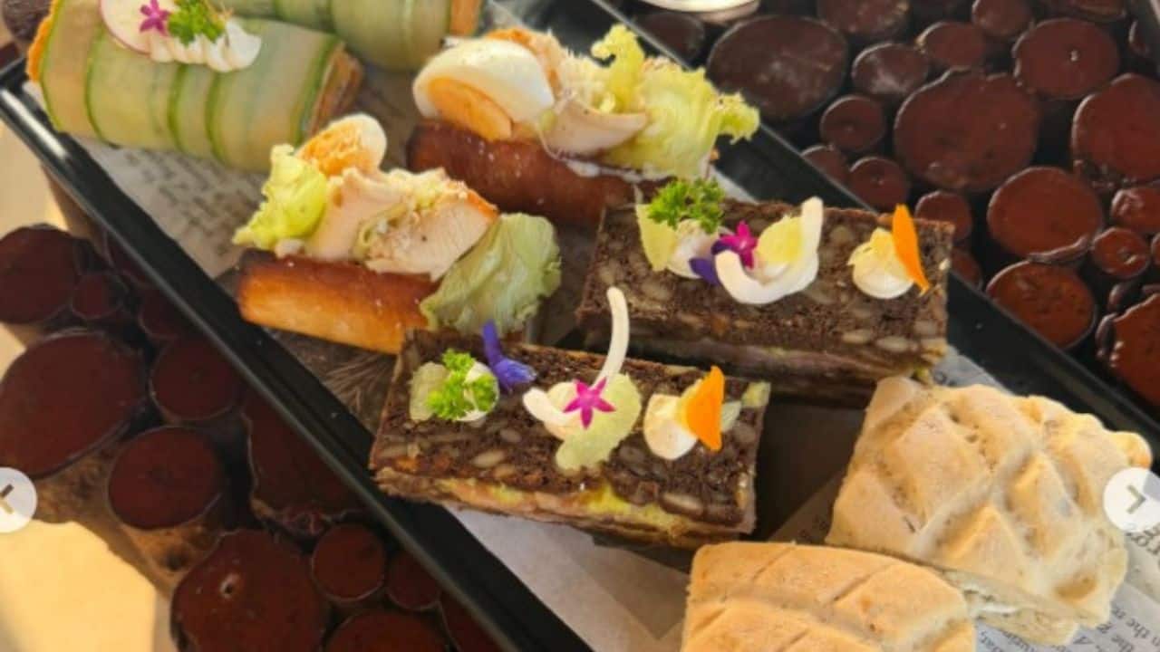 The aesthetic food spread The picture shifts gears to a delicious-looking platter of appetisers or gourmet snacks, beautifully arranged on a tray. Fresh vegetables, artful toppings, colourful garnishes, and artisanal bread pieces create an inviting, holiday-perfect eating experience. The aesthetic food spread The picture shifts gears to a delicious-looking platter of appetisers or gourmet snacks, beautifully arranged on a tray. Fresh vegetables, artful toppings, colourful garnishes, and artisanal bread pieces create an inviting, holiday-perfect eating experience.