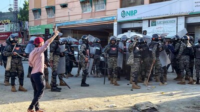 Security personnel cordon off a street during a protest by demonstrators of the Jammu Kashmir Joint Awami Action Committee on the outskirts of Muzaffarabad, the capital of Pakistan-occupied Kashmir on May 13, 2024. (AFP Photo)