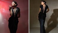 <strong>Moment in black</strong><br />An avant-garde black gown makes her look stunning. The bold moment in black is made sensuous with a sheer plunging neckline. Her sparkling earrings, soft glam, and retro bun add to the charm.