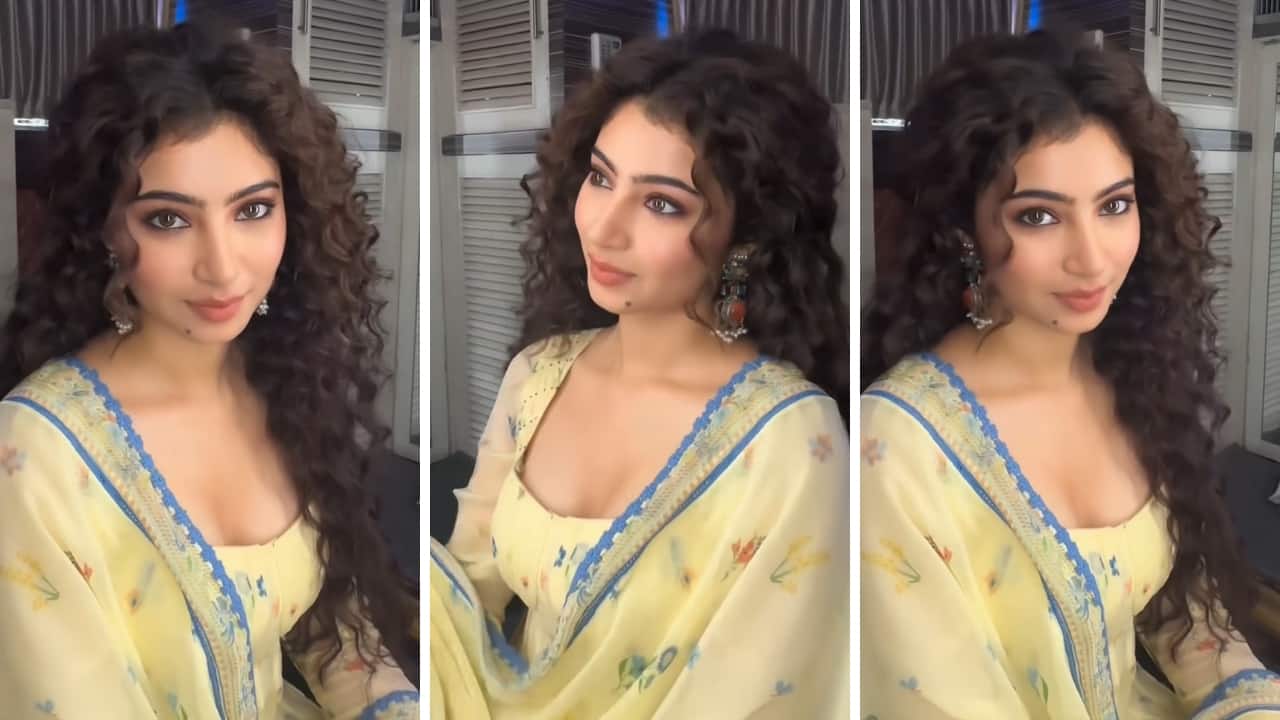 <strong>Stunning in summer pastels</strong><br />Her traditional style is as impressive as her choice of trendy Western wear. She shines in a pastel suit perfect for summers. Her outfit has been styled with antique earrings with a pop of orange colour, and the curls are not to be missed.