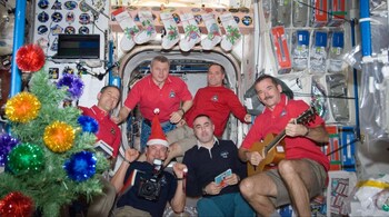 Expedition 34 crew members pictured in the Unity node of the International Space Station in December 2012. (Image: NASA)