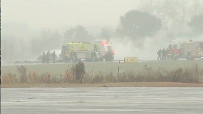 Business jet crash sparks runway blaze
